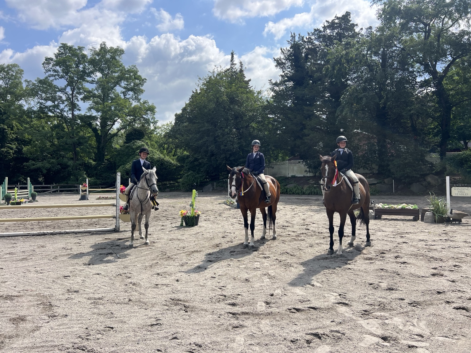 Three mounted riders together in the Winding Hill arena on show day